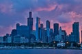 Stunning view of sunset over Chicago, seen from Lake Michigan, with boats in marina in foreground and city skyline behind. Royalty Free Stock Photo