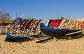 Traditional outrigger fishermen pirogue with colorful pareo in the background, Anakao coast, Indian Ocean, Madagascar