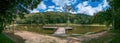 Serene panorama of Juiz de Fora botanical garden lake with wooden platform