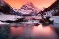 Serene Sunset at Snow-Capped Mountain Lake