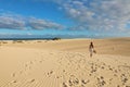 Stunning view of woman walking on Corralejo Dunas beach, Fuerteventura, Canary Islands Royalty Free Stock Photo