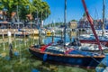 Stunning views over historic dutch yacht harbour with classic dutch historical houses and bike riders