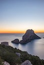 Stunning views of the sun falling behind Es Vedra with the Torre del Savinar in Es Vedra, Sant Josep de Sa Talaia, Ibiza, Spain.