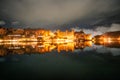 Stunning views of Udaipur City Palace at night from Lake Pichola. Royalty Free Stock Photo