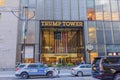 A stunning vista of the majestic entrance to Trump Tower in New York City, by the hustle and bustle of street traffic.