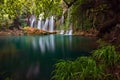 Stunning waterfalls over an emrald lake in deep green forest in Kursunlu Natural Park, Antalya, Turkey Royalty Free Stock Photo