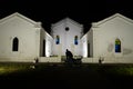 Stunning white church building illuminated at night in Quelimane, Mozambique