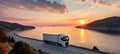 Stunning white pickup truck cruising on a picturesque road during the mesmerizing sunset