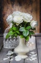 Stunning white roses in ceramic vase