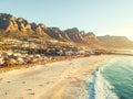 Stunning wide angle aerial drone evening view of Camps Bay, an affluent suburb of Cape Town