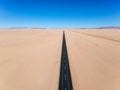 Stunning wide angle aerial drone view of the B4 desert road and a train line between LÃÂ¼deritz and Keetmanshoop