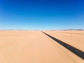 Stunning wide angle aerial drone view of the B4 desert road and a train line between LÃÂ¼deritz and Keetmanshoop