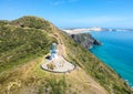 Stunning wide angle aerial drone view of Cape Reinga Lighthouse at Cape Reinga Royalty Free Stock Photo