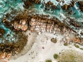 Stunning wide angle aerial drone view of rocks and breaking waves at Cape Agulhas