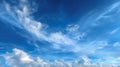 Wide-Angle View of a Deep Blue Sky with Streaky Cirrus and Puffy Cumulus Clouds. Royalty Free Stock Photo