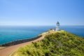 Stunning wide angle view of Cape Reinga Lighthouse and the path leading to it at Cape Reinga Royalty Free Stock Photo