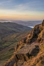Stunning Winter dawn landscape view from Red Screes in Lake District looking South towards Windermere with colorful vibrant sky Royalty Free Stock Photo