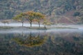 Stunning Winter foggy sunrise on Crummock Water in Lake District Royalty Free Stock Photo