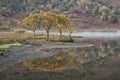 Stunning Winter foggy sunrise on Crummock Water in Lake District Royalty Free Stock Photo