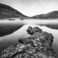 Stunning Winter foggy sunrise on Crummock Water in Lake District Royalty Free Stock Photo