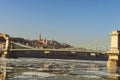 Stunning winter landscape of Chain Bridge across the River Danube. Medieval Fisherman`s Bastion on a hill in the background Royalty Free Stock Photo