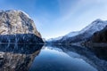 Stunning winter scene of a beautiful snow-capped mountain reflected in a lake in Olden, Norway Royalty Free Stock Photo