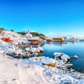 Stunning winter scenery of Moskenes village with ferryport and famous Moskenes parish Churc