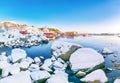 Stunning winter scenery of Moskenes village with ferryport and famous Moskenes parish Churc