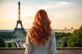 A stunning woman with fiery red hair posing confidently in front of the iconic Eiffel Tower, Young woman\'s rear view