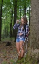 Stunning woman hiker in flannel with tekking poles Royalty Free Stock Photo