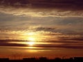 Stunningly beautiful Golden sunset over the town Nadym. The cloudy sky.