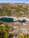 Picturesque lake in the High Sierras surrounded by granite rocks Royalty Free Stock Photo