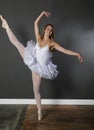 Stunningly beautiful young blonde ballerina in studio