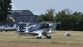 Stunt airplane taxiing on grass airstrip during a small airshow