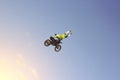 A stunt biker performs a trick in the sky Royalty Free Stock Photo