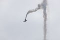 Stunt flying with smoke Royalty Free Stock Photo