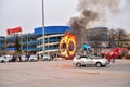 Stunt man made the jump into burning rings of a moving car during the show Lada-truck Rodeo thing in St. Petersburg
