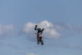 Stunt Motocross motorbike rider on a jump