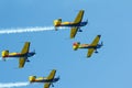 Stunt plane flying against clear blue sky. Royalty Free Stock Photo