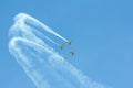 Stunt plane flying against clear blue sky. Royalty Free Stock Photo