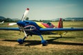 Stunt plane on grassy airport. Royalty Free Stock Photo