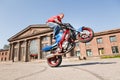 Stunt rider making wheelie