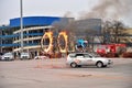 The stuntman jumped through two burning rings of a moving car during the show Lada-truck Rodeo thing in St. Petersburg