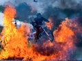 Stuntman jumps motorbike through fire explosion