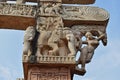 Stupa No 1, East Gateway. Pillar capitals are supported by four elephants. Carved damsels or Shalabhanjikas are seen clinging to t Royalty Free Stock Photo