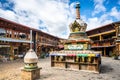 Stupa and old Tibetan houses street view in Dukezong old town in Shangri-La Yunnan China