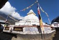 Stupa with prayer flags and wheels Royalty Free Stock Photo