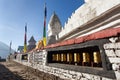 Stupa with prayer flags and wheelsin Royalty Free Stock Photo