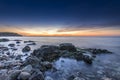 Stupendous rocky seacost after sunset Royalty Free Stock Photo