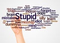 Stupid word cloud and hand with marker concept Royalty Free Stock Photo